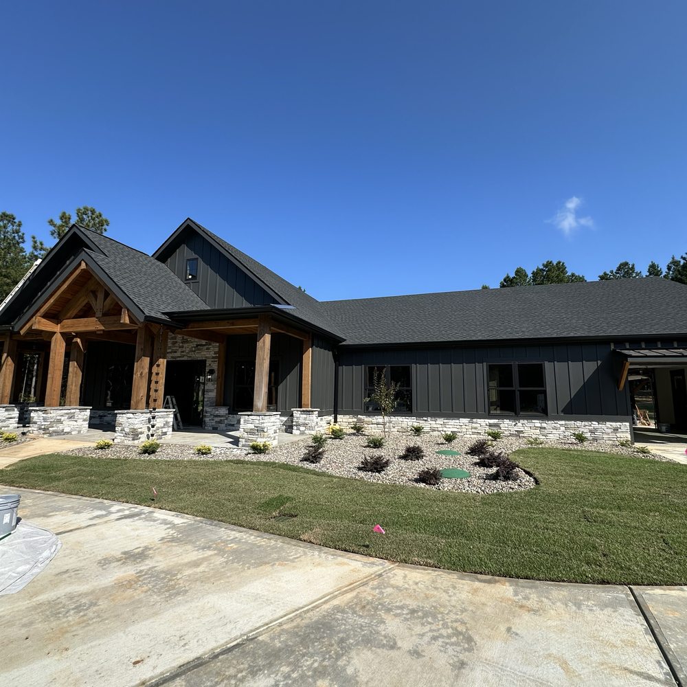 Freshly painted residential exterior under a clear sky