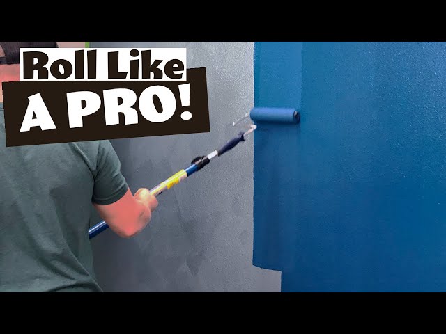 Painter applying an even coat with a roller
